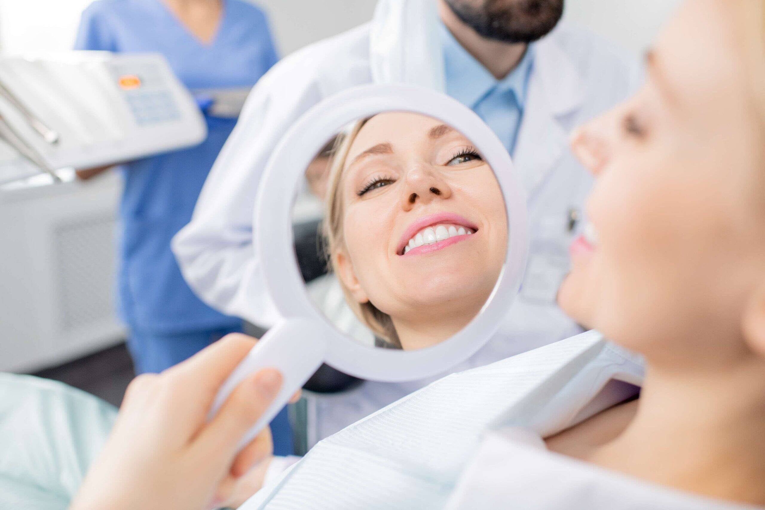 Patient viewing her smile in a mirror